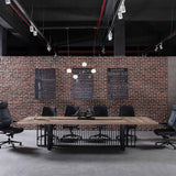 Vantage 2400 Boardroom Table in a boardroom setting with Warm Oak top and black base