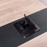 Close-up of the Vantage boardroom table open cable grommet in the tabletop