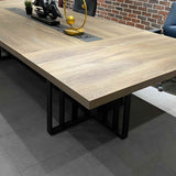 Vantage boardroom table Warm Oak top close-up with black base below