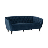 Blue velvet 3 seater sofa styled in a lounge room setting