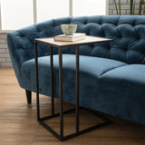 Blue velvet sofa side angle with black oak legs